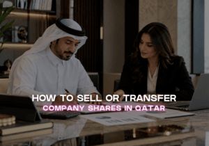 Business partners reviewing documents for a company share transfer in Qatar